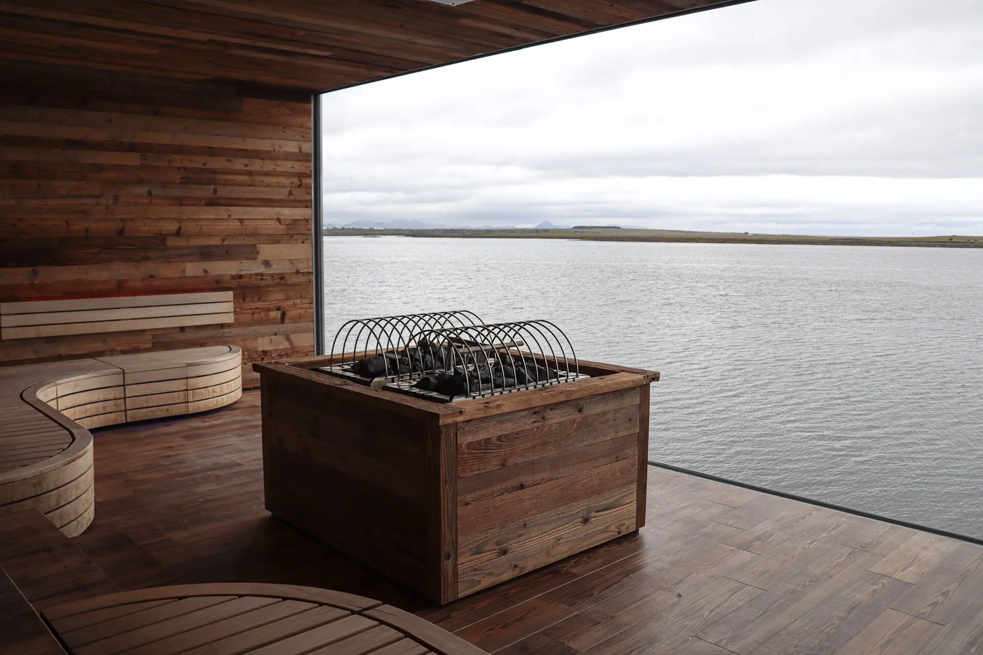 A sauna with a wide window over the sea at Sky Lagoon, Iceland