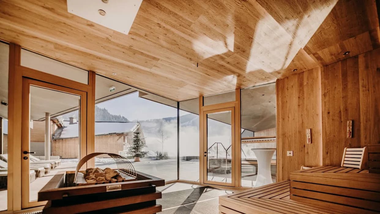 Modern commercial sauna interior with wooden benches and atmospheric lighting