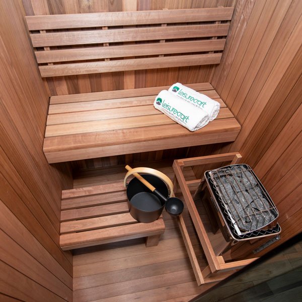 Leisurecraft CT Element indoor sauna interior showing Thermo Grandis wood benches and glass front panel