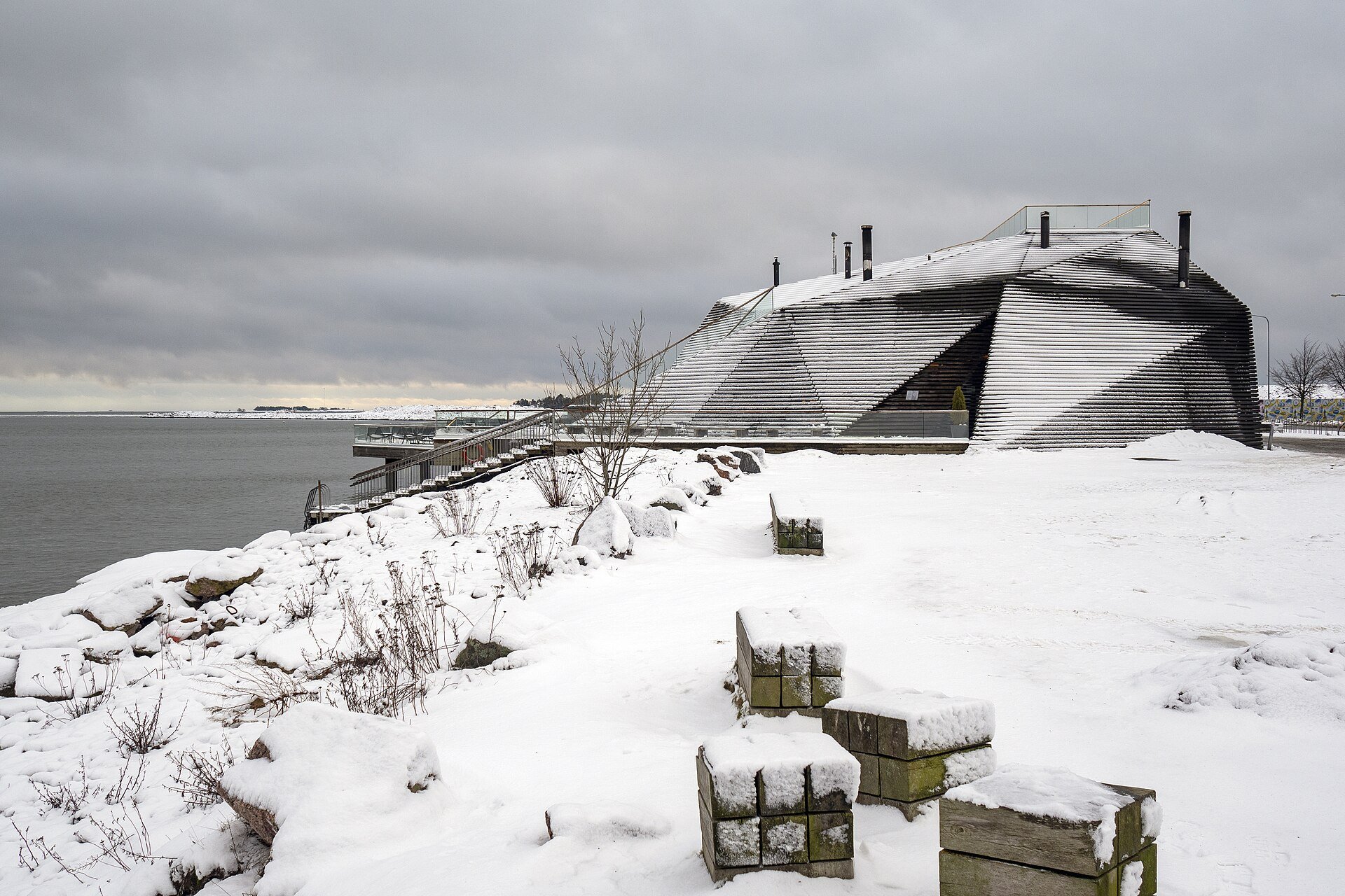 Löyly, the modern public sauna on the Helsinki seafront, under snow