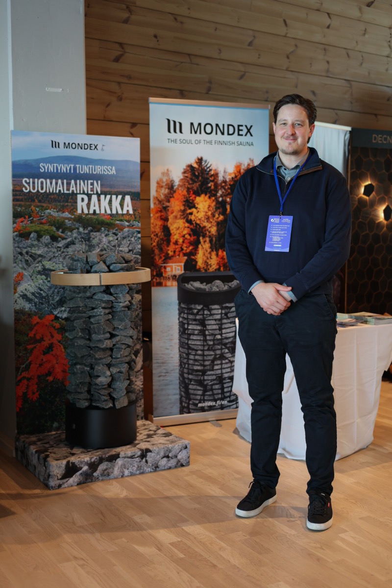 Teppo Petajisto, chief executive of Mondex Oy, standing beside Mondex display materials