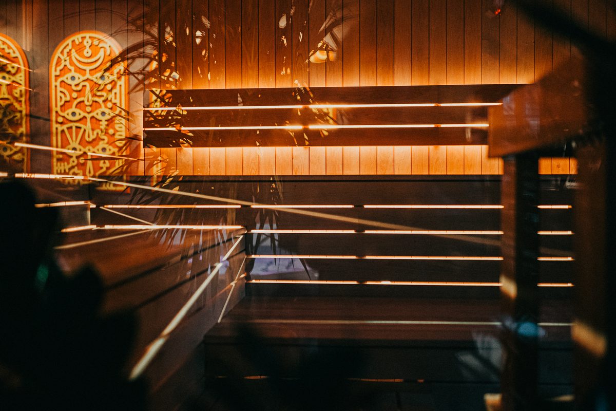 Cold plunge area at Portal° Thermaculture's Minneapolis West Maka Ska location, showing the communal pool in a warmly lit community space