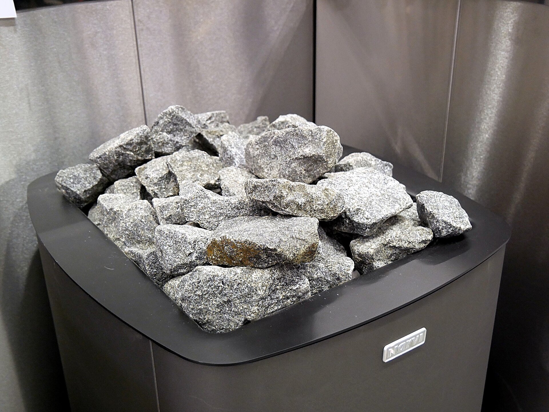 Sauna stones piled on top of an electric heater