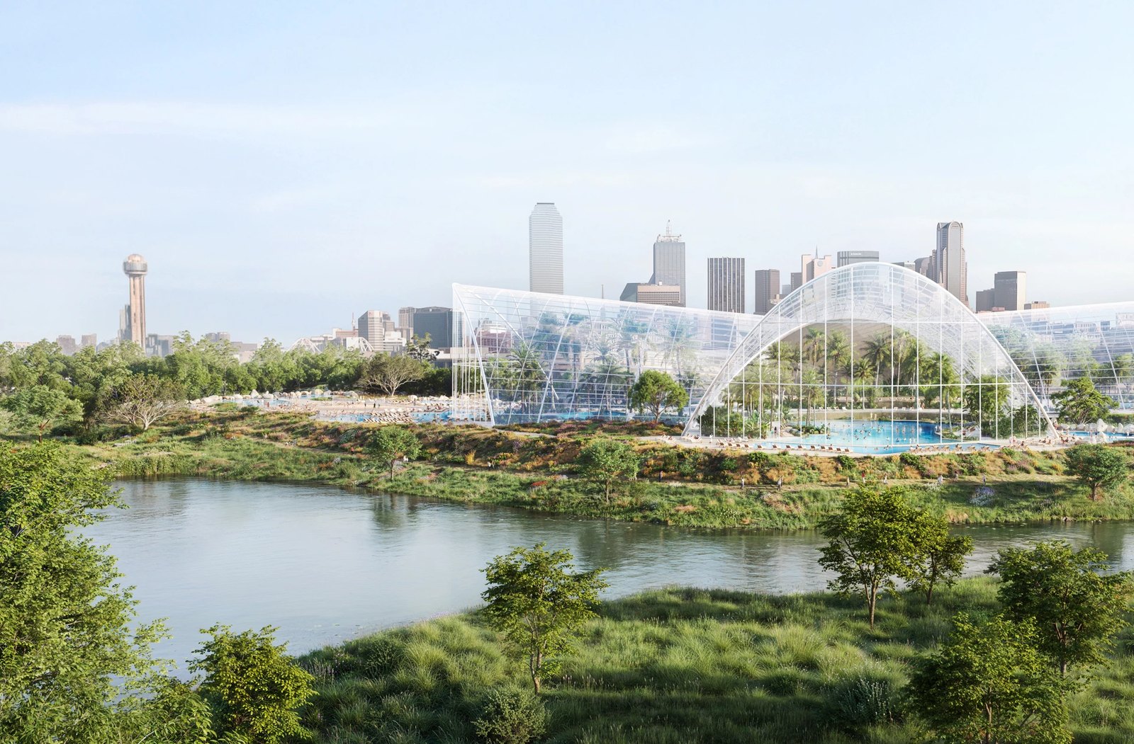 Rendering of the proposed Therme Dallas wellbeing destination, a glass-and-steel arched enclosure holding pools and planting on the Trinity River in the Cedars, with the downtown Dallas skyline and Reunion Tower behind it